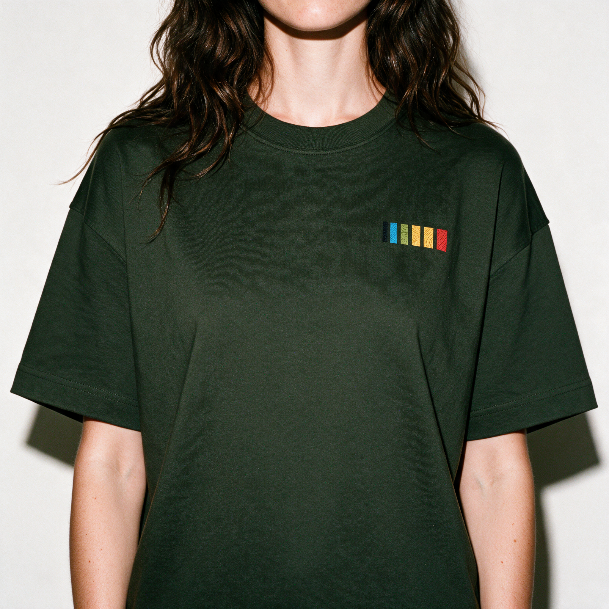Essential Boxy Tee - Dark Green - chest graphic detail